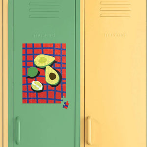 Two lockers, one green and one yellow, with an avocado-themed poster on the green locker.