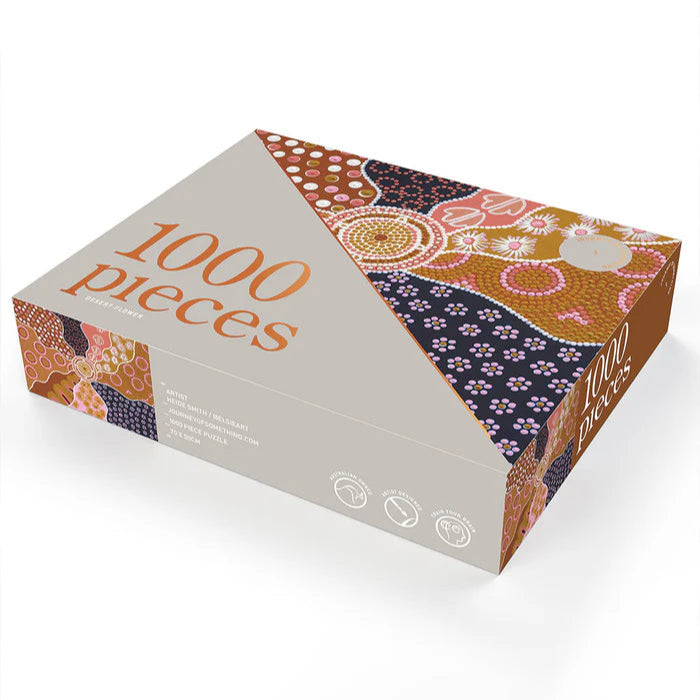 Jigsaw puzzle box with a patterned design and '1000 pieces' text on a white background