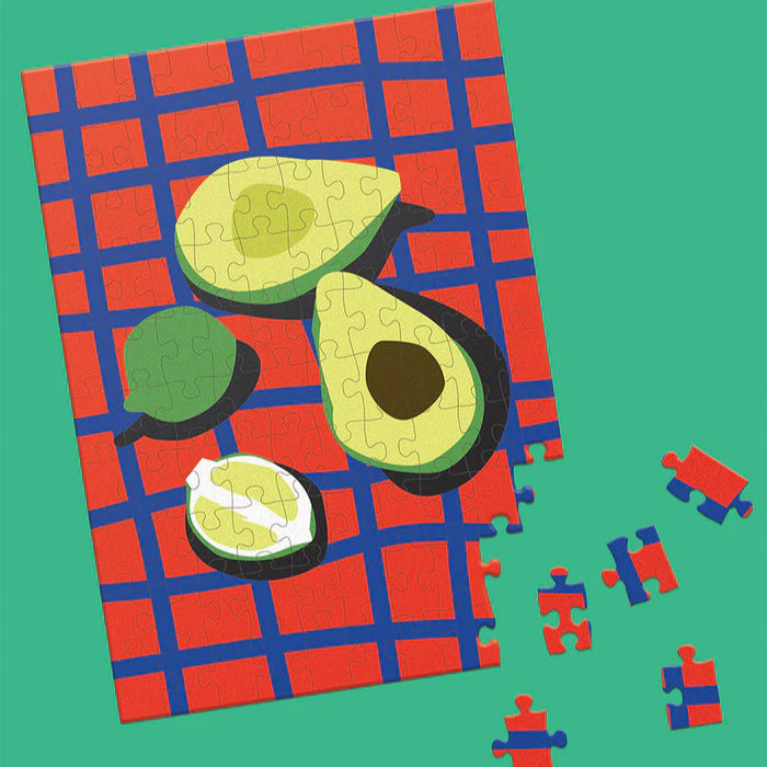 Avocado-themed puzzle with missing pieces on a green background