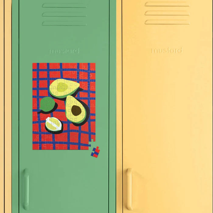 Two lockers, one green and one yellow, with an avocado-themed poster on the green locker.