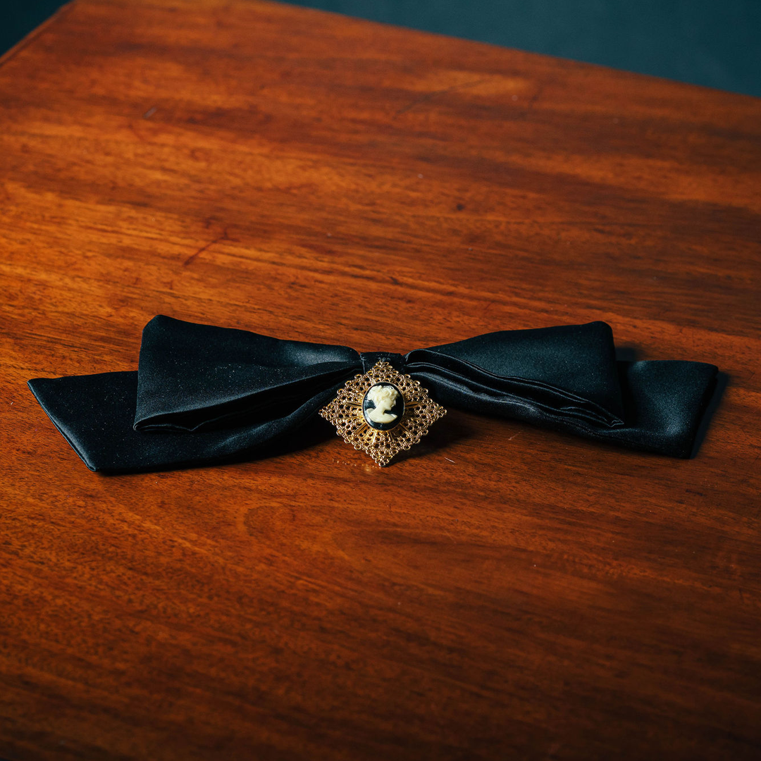 Broochella Camée Royale – Black Satin Bow with Ornate Cameo Brooch