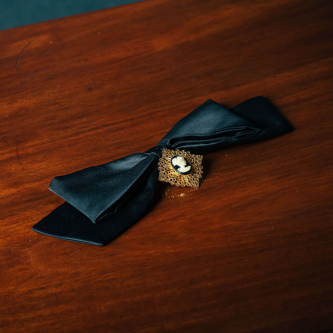 Broochella Camée Royale – Black Satin Bow with Ornate Cameo Brooch