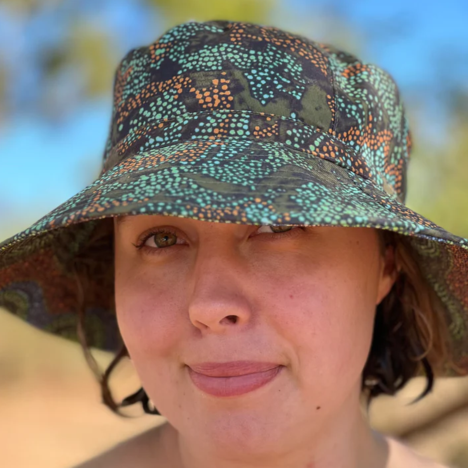 Juluwarlu Group Reversible Bucket Hat - Waterholes and Wildflowers (Joylene Warrie)